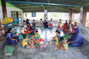 The students of Kindergarten are enjoying themselves playing different games.