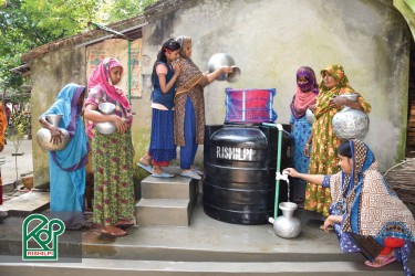 The Villagers are fetching water from Rishilpi Community Filters.